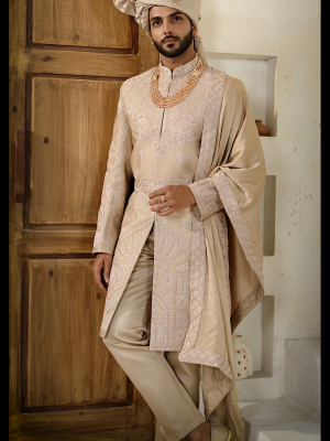 A luxurious beige embroidered sherwani